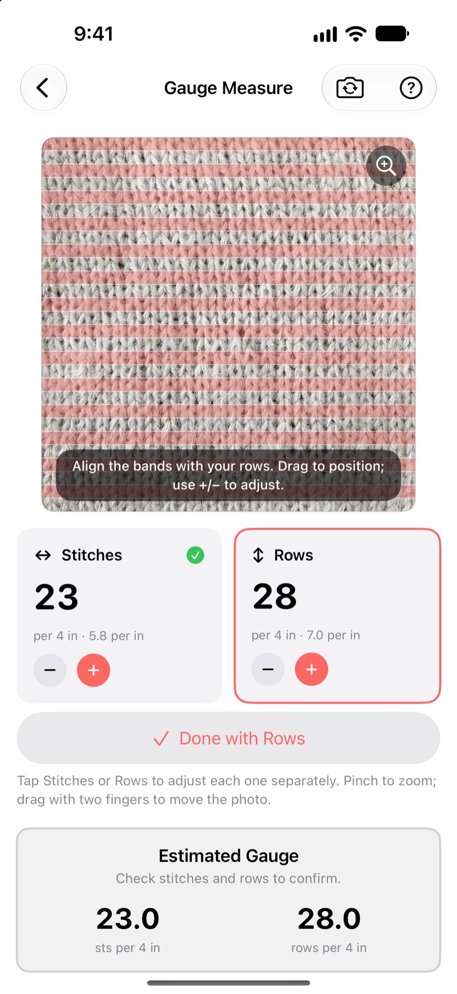 KnitHub Gauge Measure aligning guides over a striped knitted swatch